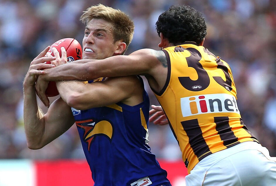 2015 Toyota AFL Grand Final - Hawthorn v West Coast MELBOURNE, AUSTRALIA - OCTOBER 3: Brad Sheppard of the Eagles is tackled by Cyril Rioli of the Hawks during the 2015 Toyota AFL Grand Final match between the Hawthorn Hawks and the West Coast Eagles at the Melbourne Cricket Ground, Melbourne, Australia on October 3, 2015. (Photo by Adam Trafford/AFL Media)
